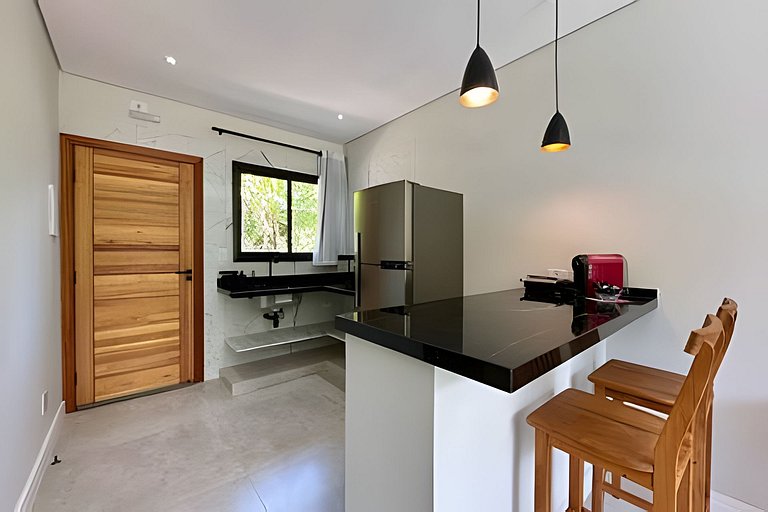 Flat em frente a Praia do Veloso