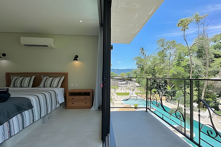 Flat em frente a Praia do Veloso