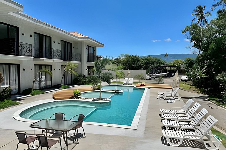 Flat em frente a Praia do Veloso