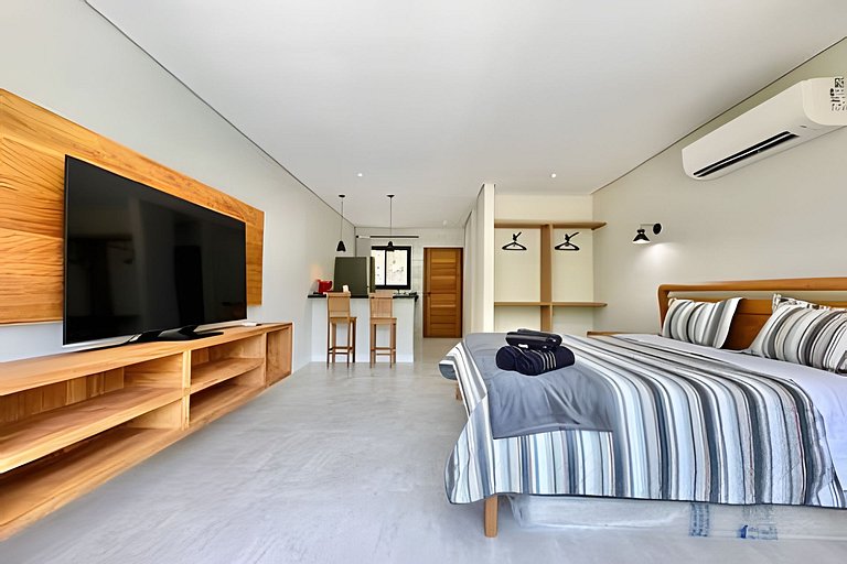 Flat em frente a Praia do Veloso