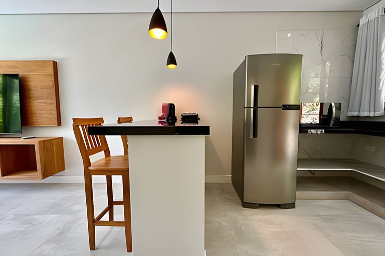 Flat em frente a Praia do Veloso