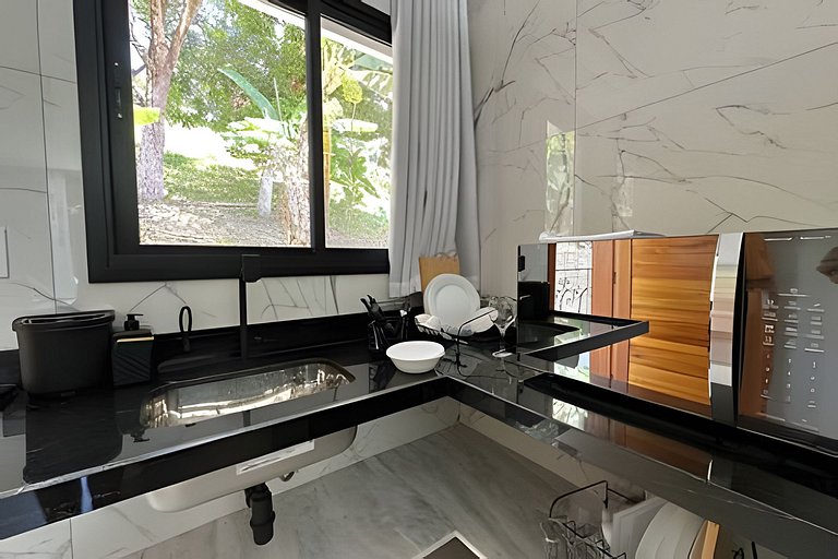 Flat em frente a Praia do Veloso