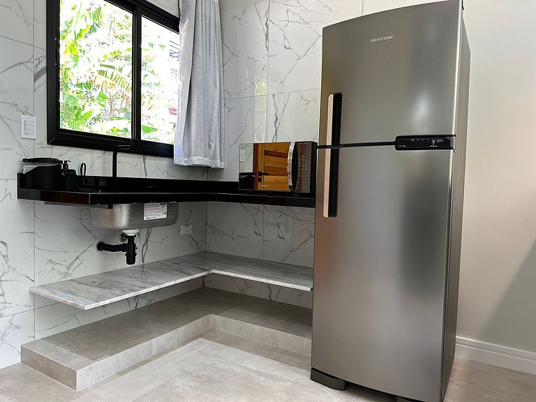 Flat em frente a Praia do Veloso