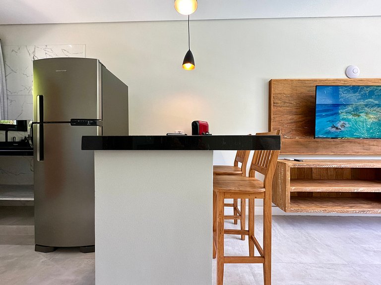 Flat em frente a Praia do Veloso