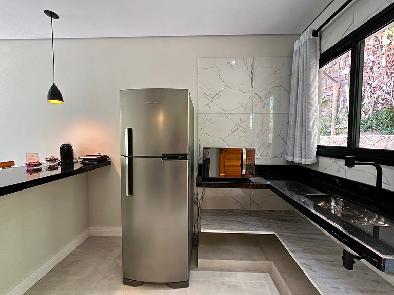 Flat em frente a Praia do Veloso