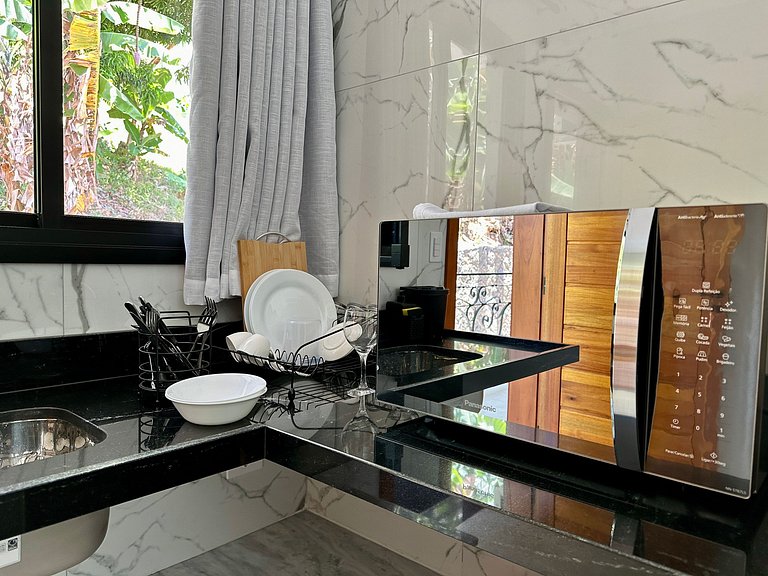 Flat em frente a Praia do Veloso