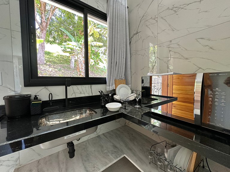 Flat em frente a Praia do Veloso